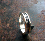 zilver met dubbelle platte knoop als symboliek